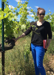 Vanessa, Sales Manager at Bourget in the vineyard of Chateau Mourgues du Gres